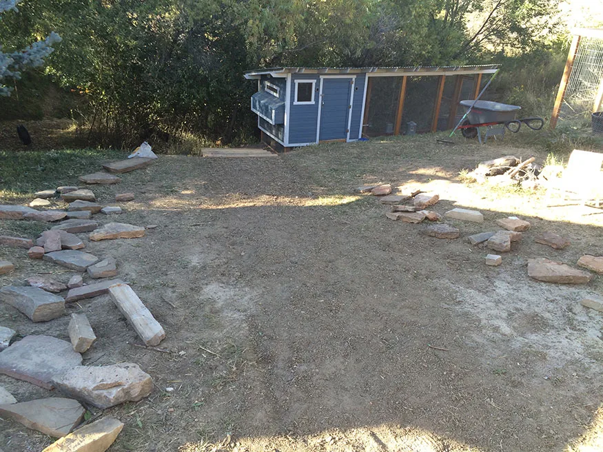 Preparing the ground for a flagstone path.