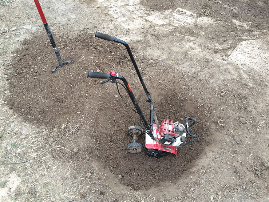 Using a Tiller to breakup the Tough Soil