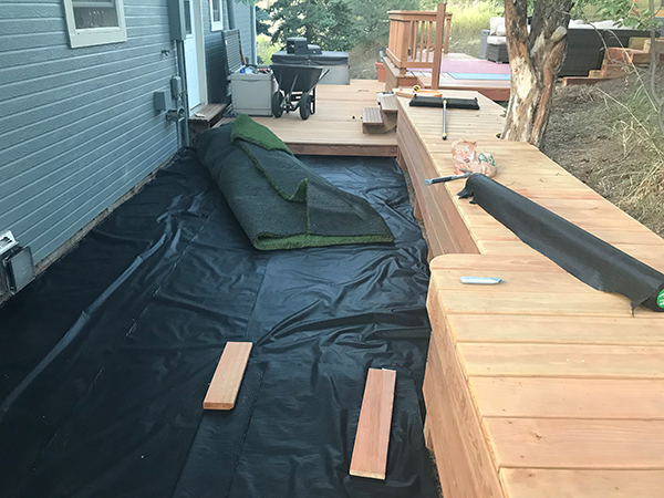 Moving the large artificial turf in to place 